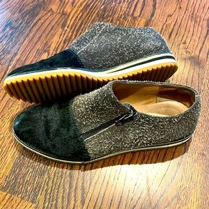 ALL BLACK slip on zip up sneaker.  Black fur across the toe and fuzzy all over.